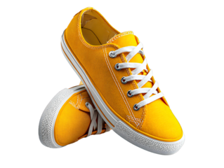 Yellow canvas sneakers with white laces isolated on transparent background
