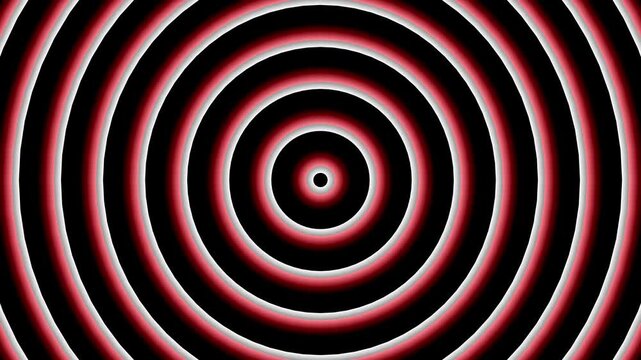 Concentric red circles on black background