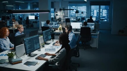 Group of professionals collaborating in a high-tech engineering office filled with computer screens and technical equipment, representing teamwork and innovation.
- Powered by Adobe