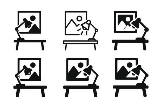 Creative Workspace Logos. Creative workspace with art on walls. Set Logo of Creative workspace with art on walls: desk lamp illuminating a canvas on the wall.