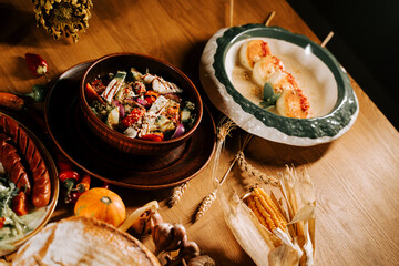 Colorful harvest feast with fresh ingredients served on rustic wooden table