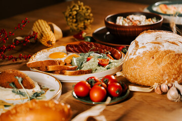 Delicious breakfast spread featuring fresh ingredients and hearty bread on a wooden table