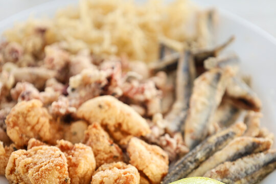 Andalusian fried food of chanquetes, marinated dogfish, anchovies and little squids