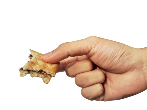 Holding a chocolate filled cracker in hand, isolated on PNG background.