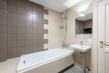 Modern Home Bathroom Interior With Bathtub, Sink, Wall Tiles, and Neutral Tones