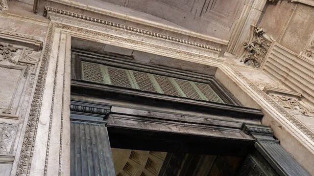 tilted pan interior pantheon temple rome including inscriptions walls arches windows clarity view architectural detail monumental architecture grandeur 