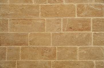 New yellow stone wall  closeup in Lecce, Italy