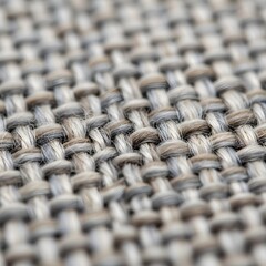 Shallow depth of field macro of neutral fabric texture, close-up detail of grey and beige woven textile