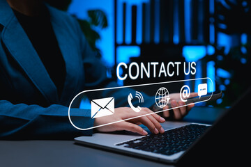 Contact us communication concept. Businesswoman using laptop and smartphone to connect via email, phone and online chat. Modern customer support platforms and digital service interaction technology.