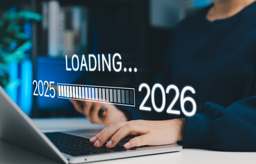 New year transition concept. Woman using laptop with progress bar loading from 2025 to 2026, symbolizing planning, change, goal setting, upcoming year, and digital transformation for future goals.
