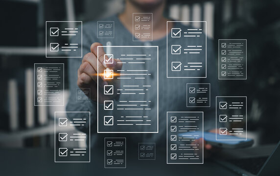 Digital checklist management concept. Businesswoman using virtual touchscreen interface to mark tasks, representing productivity, workflow planning, and smart task tracking in a digital workspace.