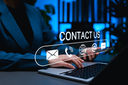 Contact us communication concept. Businesswoman using laptop and smartphone to connect via email, phone and online chat. Modern customer support platforms and digital service interaction technology.
