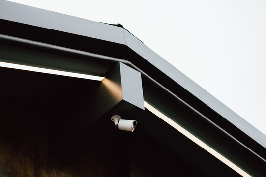 networkconnected camera positioned underneath eave to monitor urban area effectively during daytime