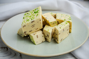 traditional arabic sweets sesame halva with pistachio and nuts. Egyptian halva