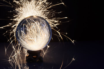 Sparks and Glass. A glass sphere reflecting vibrant sparks