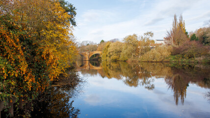 The river bank at Yarm showing the Yarm Road bridge over the river tees