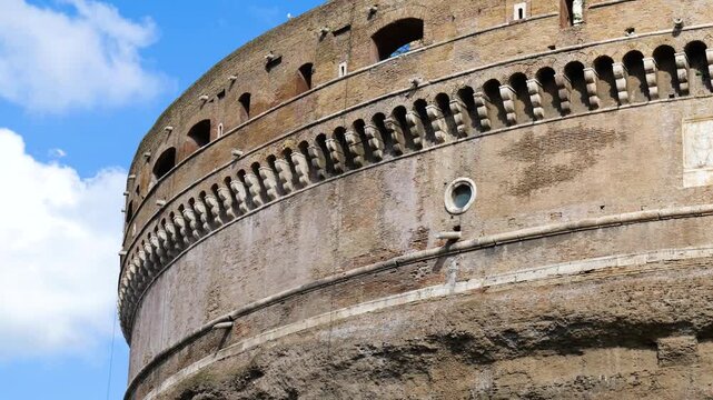 bottom castel sant'angelo bricked structure arches windows beneath cloudy sky to reveals closeup top mausoleum of hadrian rome italy roman empire emperor 