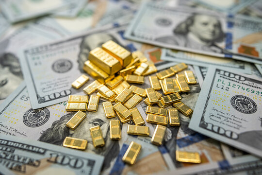 Dollar banknotes and gold bullion showing economy trends, trade investment, and currency exchange