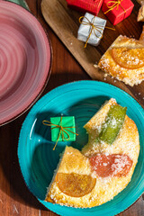 Homemade Rosco de Reyes cake on a festive table