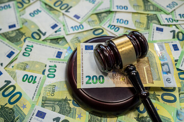 Judge gavel with 100 euro bills symbol of law and justice system