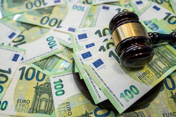 Judge gavel with 100 euro bills symbol of law and justice system