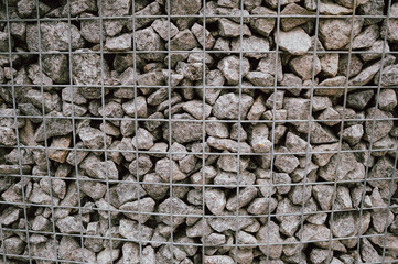 industrial style wire cages filled with mineral gray stones for architectural and fencing applications