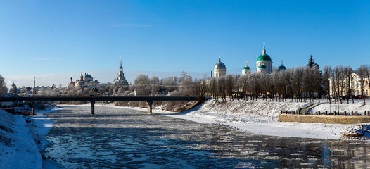 Panorama of the Tvertsa River in winter with a view of the Borisoglebsky Monastery and the Transfiguration Cathedral. Torzhok, Tver Oblast, Russia