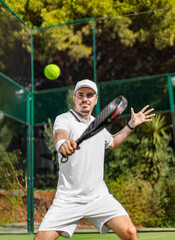 Padel player on the padel court with padel racket and ball in action. Open social tour template....