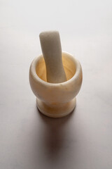 Simple Marble Mortar and Pestle on White Surface
