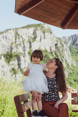 A mother and a daughter bonding in nature