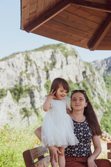 A mother and a daughter bonding in nature