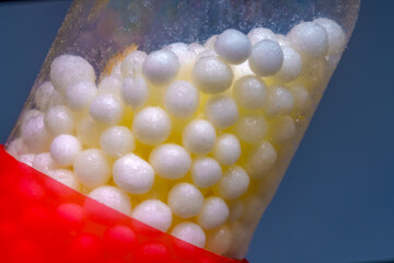 Red and White Medical Capsule with Granules Inside