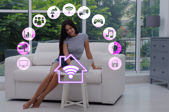 Smart home. Different icons on virtual screen and happy woman using laptop in room