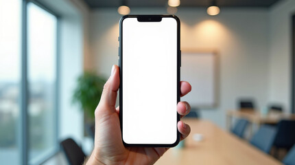 Hand Holding Modern Smartphone with White Screen Mockup in Bright Corporate Office Setting: App Display Template