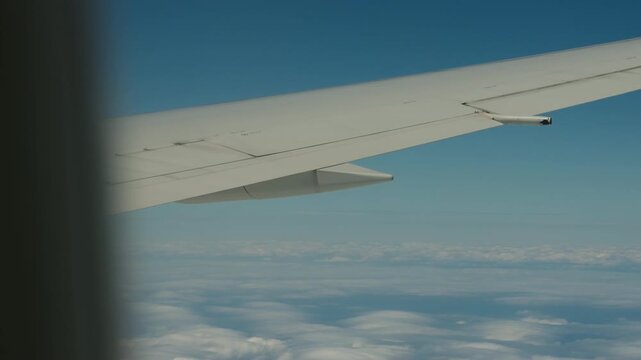 Airplane winglets view from window seat with the sky in the background