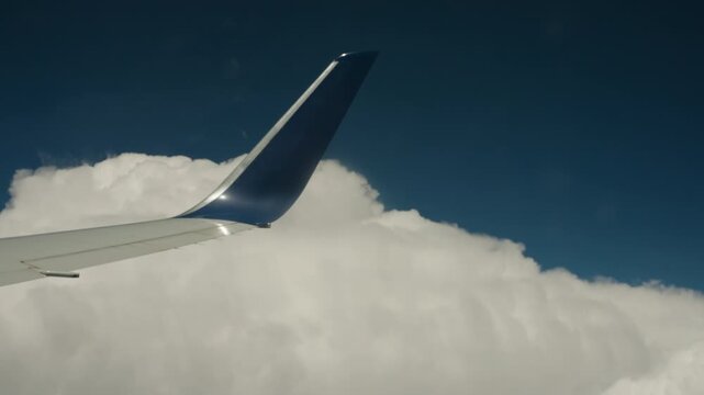 Airplane winglets view from window seat with the sky in the background