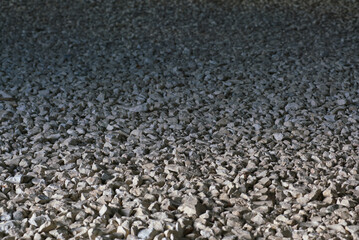 Coarse gravel floor in industrial building under construction