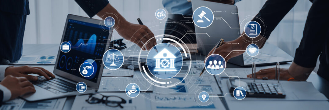 A collaborative business meeting focused on finance and legal matters, showcasing technology and digital icons to enhance teamwork and strategy in a modern workspace. Trope