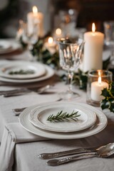 Fototapeta premium Elegant Christmas table setting with holly decoration and candles. Concept: timeless holiday style, minimalism with natural elements.