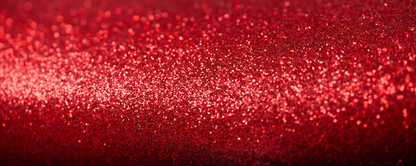 Macro of rich red glitter texture. Abstract festive background with sparkling bokeh. Ideal for a holiday web banner or header. Photo