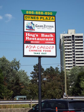 Ottawa, ON, Canada-June 25,2025:The pylon sign, clearly labeled :Dynes Plaza", lists the businesses and their corresponding street numbers on Dynes Road
