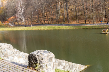 Stone Embankment Beside Autumn Forest Lake