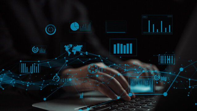 A close-up view of hands typing on a laptop with holographic data analytics and graphs, representing the fusion of technology and business innovation in the digital age. Xenic