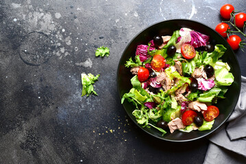Tuna salad with fresh vegetables. Top view with copy space.