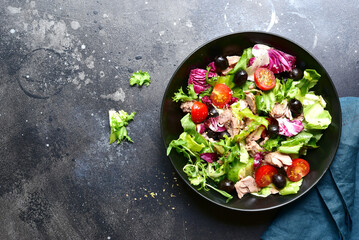 Tuna salad with fresh vegetables. Top view with copy space.
