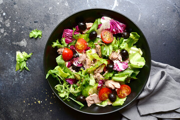 Tuna salad with fresh vegetables. Top view with copy space.