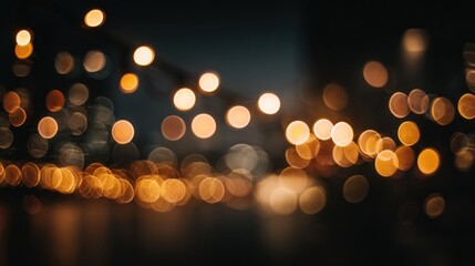 Abstract bokeh lights on dark background with warm yellow and beige tones. Defocused lighting concept for design.