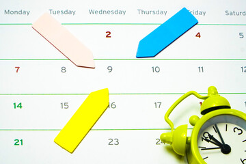 Pastel Colorful sticky Notes on white background , arrow shape with calendar and alarm clock. Reminder concept
