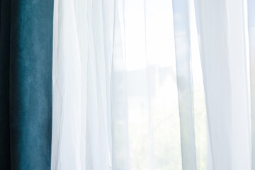 sunlight diffuses softly through sheer fabric, serene hotel room ambiance bathed in natural light, calm and peaceful interiors accented by flowing curtains and warm daylight streams