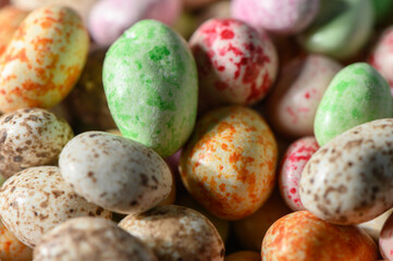 Peanuts in Milk Chocolate and Multicolored Glaze Close-Up Glossy